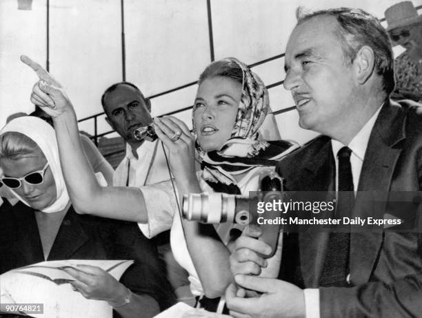 The prince and princess watching the Olympic rowing events at Castelgandolfo in September 1960. Princess Grace�s sister is with them. American film...