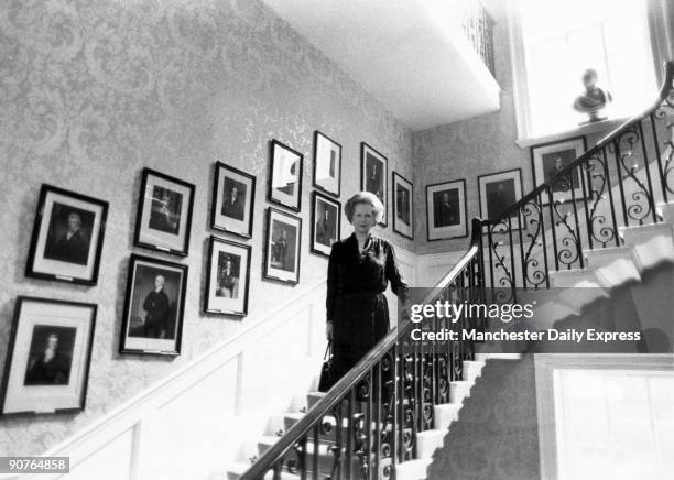 The Prime Minister on the Grand Staircase which was built to a cantilever design with no visible supports. Framed portraits of every prime minister...