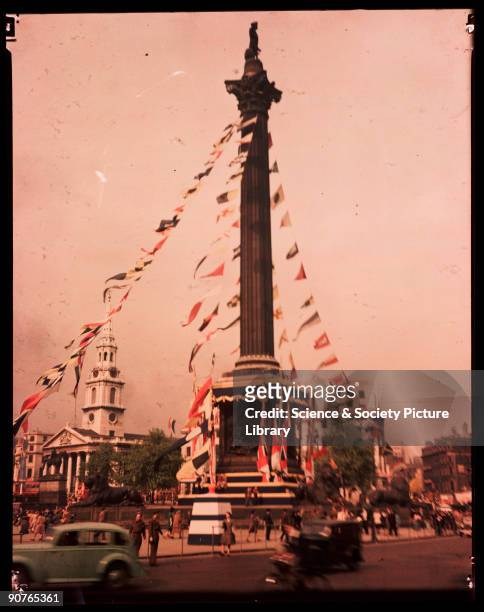 Dufaycolor colour transparency of Trafalgar Square in London, taken by an unknown photographer in May 1945. Nelson's Column is decked with bunting...