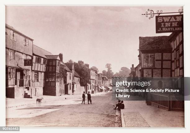 Photographic view looking down Homend Street in Ledbury, Herefordshire, with the Swan Inn on the right, published by Francis Bedford & Co. Bedford...