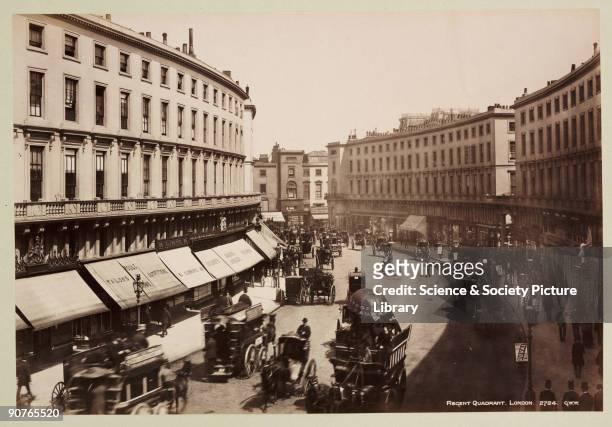 Parasol advertises the Metropolitan Railway and men wear �Duval� sandwich boards. A photograph from an album of sixty photographic views of London,...
