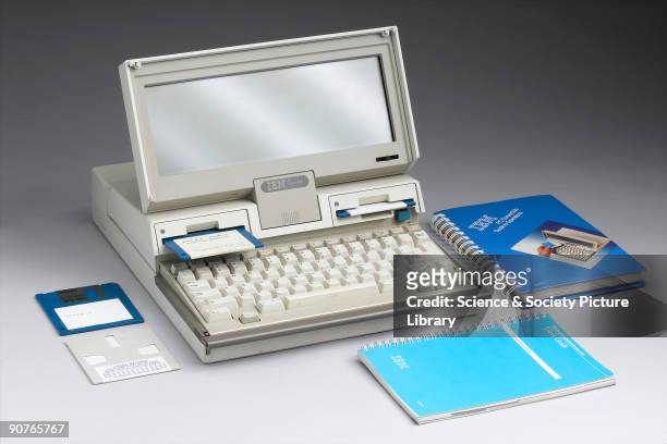 Laptop computer, model 5140, sometimes known as a PC convertible, made by IBM, New York, USA, shown here with user manuals. The IBM Personal Computer...