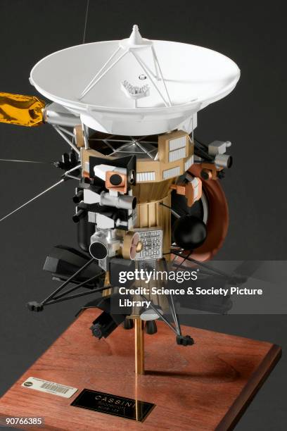 Model of the unmanned NASA spacecraft designed to send information back from Saturn and its satellites. The spacecraft uses a variety of instruments...