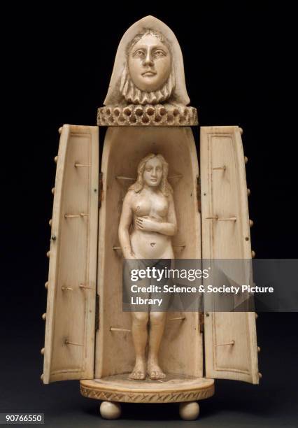 Ivory model of iron maiden with woman inside, European.