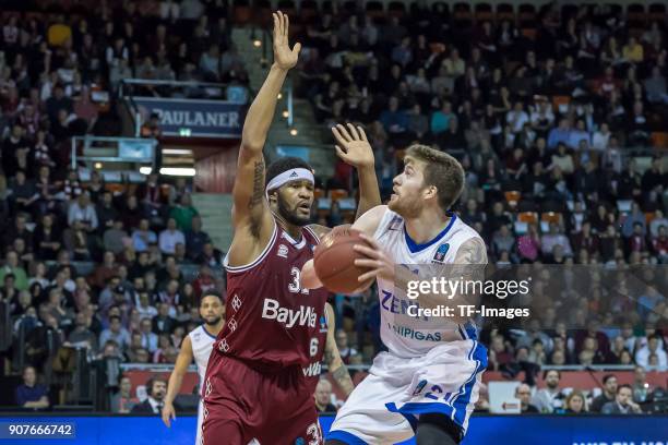 Devin Booker of Muenchen and Shayne Whittington of St. Petersburg battle for the ball during the EuroCup Top 16 Round 3 match between FC Bayern...