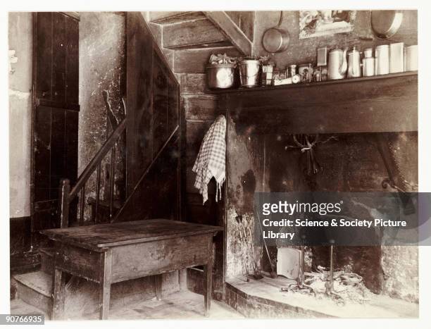 Snapshot photograph of a kitchen interior, taken by an unknown photographer in about 1905. Originally a shooting term, the word 'snapshot' was first...