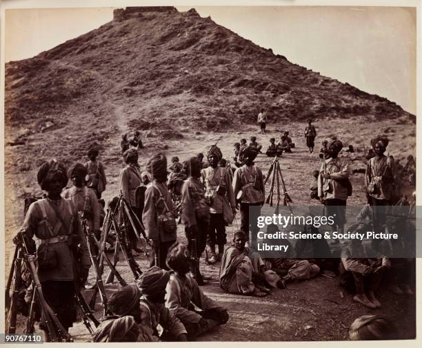 Photograph of soldiers of the 45th Rattray's Sikh Regiment guarding Afghan prisoners, taken by John Burke [1845-1900] in about 1878. This photograph...