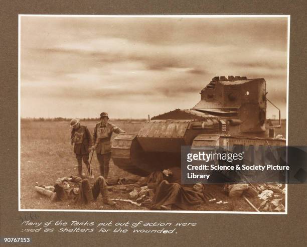 British Mark A tank surrounded by wounded allied soldiers, taken by an unknown photographer in about 1917, during World War One. The Mark A tank,...