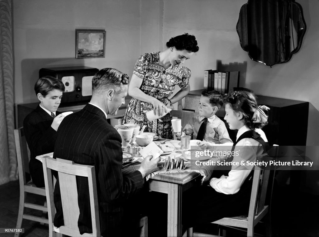 Family at breakfast, c 1948.