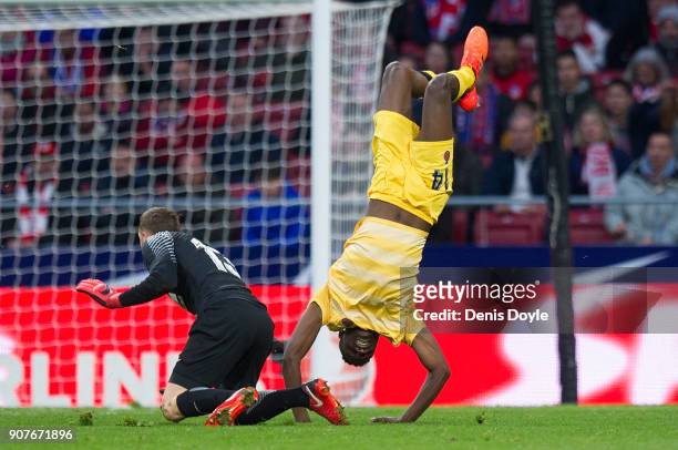 Jonas Ramalho of Gerona flips over after being fouled by Jan Oblak of Atletico de Madrid during the La Liga match between Atletico Madrid and Girona...