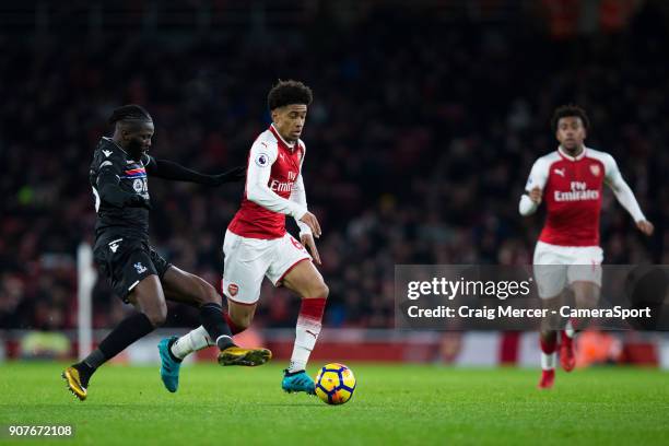 Arsenal's Reiss Nelson holds off the challenge from Crystal Palace's Bakary Sako during the Premier League match between Arsenal and Crystal Palace...