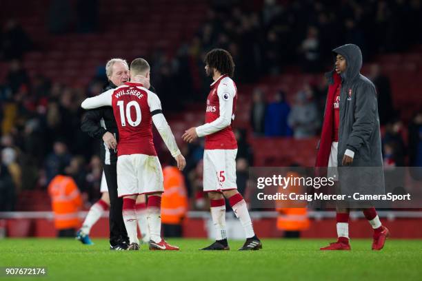 Crystal Palace's assistant manager Ray Lewington has a word with Arsenal's Jack Wilshere at full time during the Premier League match between Arsenal...