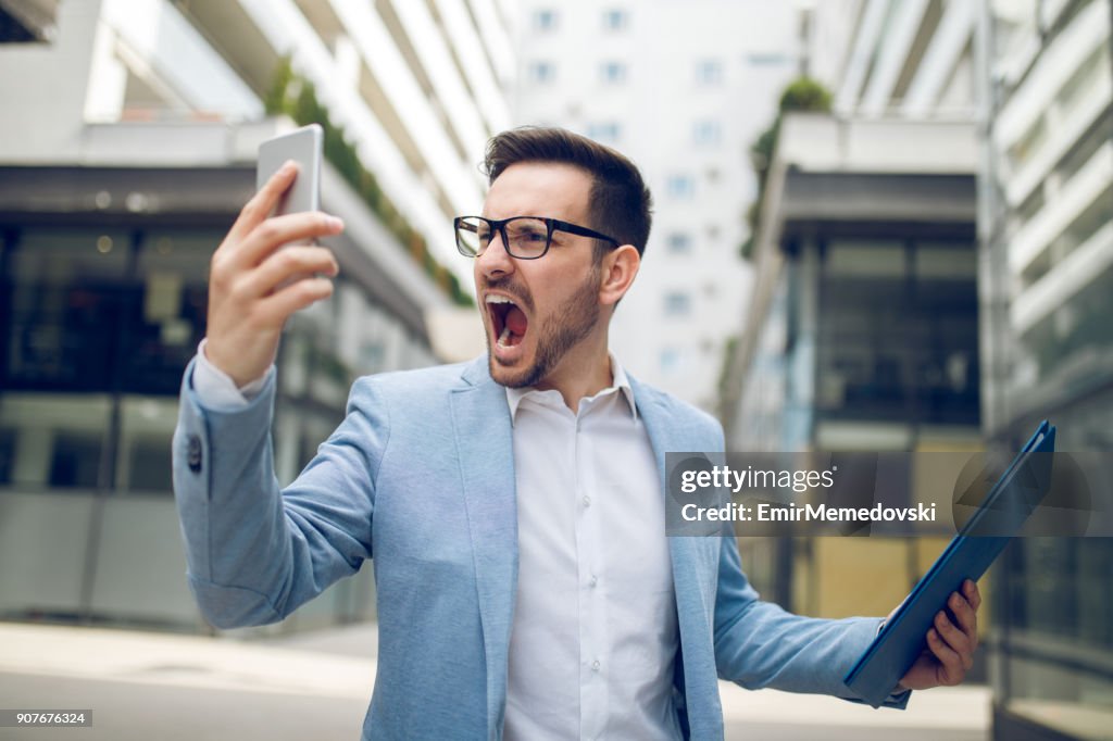 Businessman on the phone shouting