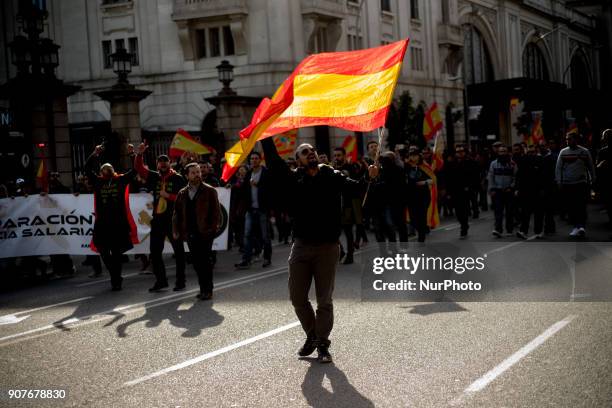 In Barcelona, Catalonia, Spain people wave Spanish flags during a protest by police officers on 20 January, 2018. Thousands of police called by...