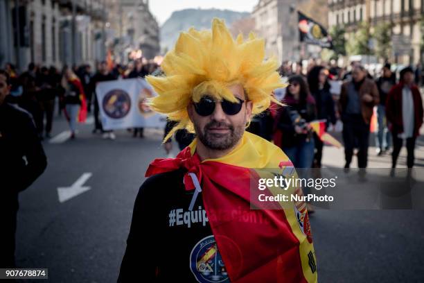 In Barcelona, Catalonia, Spain a man wrapped with a Spanish flag marches during a protest by police officers on 20 January, 2018. Thousands of police...