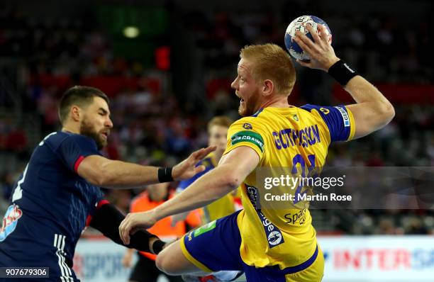 Jim Gottfridsson of Sweden challenges Luka Karabatic of France during the Men's Handball European Championship main round match between Sweden and...