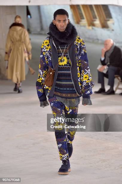 Model walks the runway at the Sacai Autumn Winter 2018 fashion show during Paris Menswear Fashion Week on January 20, 2018 in Paris, France.