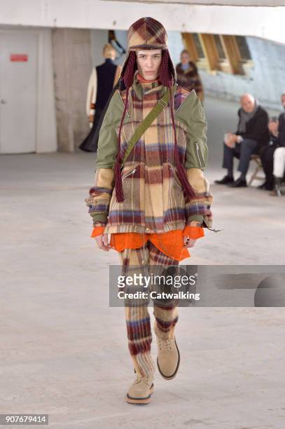 Model walks the runway at the Sacai Autumn Winter 2018 fashion show during Paris Menswear Fashion Week on January 20, 2018 in Paris, France.