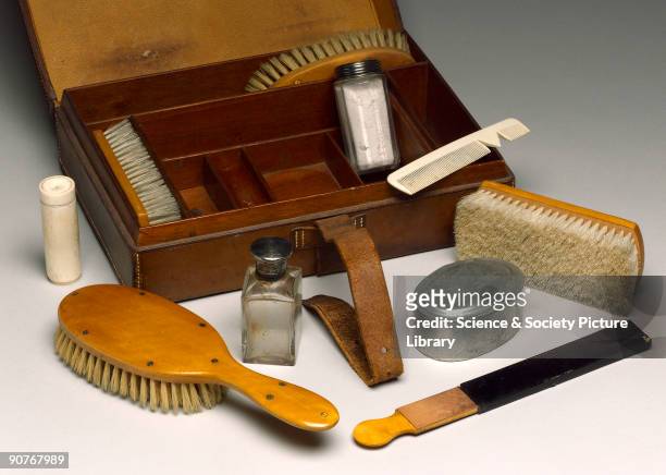 Case comprising two clothes brushes, two hair brushes, two open razors, nail trimming knife, scissors, botton hook, mirror, strop , comb, hair oil...