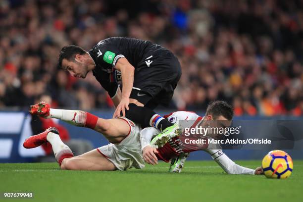 Laurent Koscielny of Arsenal tangles with Luka Milivojevic of Crystal Palace during the Premier League match between Arsenal and Crystal Palace at...