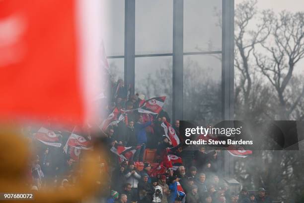 Saracens supporters wave their flags prior to the European Rugby Champions Cup match between Saracens and Northampton Saints at Allianz Park on...