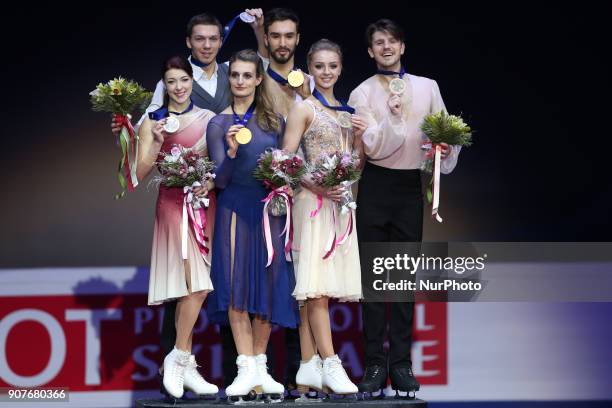 Ekaterina Bobrova and Dmitri Soloviev of Russia, left and silver medalists, Gabriella Papadakis and Guillaume Cizeron of France, center and gold...