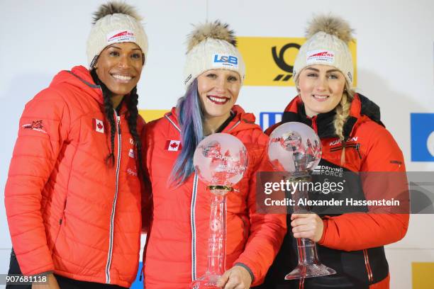 Kaillie Humphries , Melissa Lotholz and Phylicia George of Canada celebrate winning the overall World Cup at Deutsche Post Eisarena Koenigssee after...
