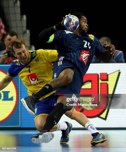 Max Darj of Sweden challenges Cedric Sorhaindo of France during the Men's Handball European Championship main round match between Sweden and France...