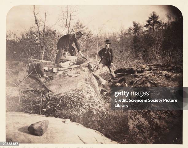 Albumen print of doctors with dead bodies on the battlefield at Gettysburg, Pennsylvania. Culp's Hill was on the extreme right flank of the Union...