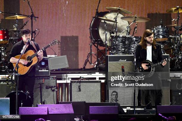 Singers Marcus Mumford and Winston Marshall of the band Mumford & Sons perform onstage during the iHeartRadio ALTer EGO concert at The Forum on...