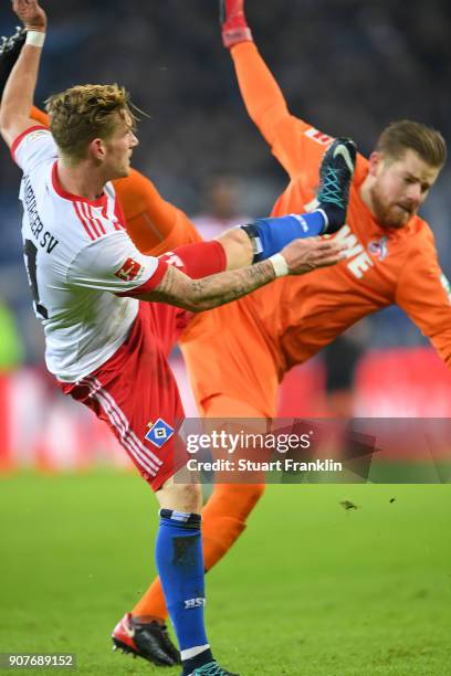 Andre Hahn of Hamburg and Timo Horn of Koeln fight for the ball during the Bundesliga match between Hamburger SV and 1. FC Koeln at Volksparkstadion...