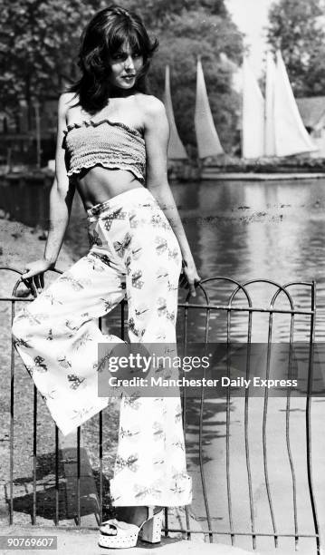 Red and white spotted shirred cotton top, £5.25; white cotton bags trimmed with printed bows, £5.25. Both by Miss Mouse at Peter Robinsons....