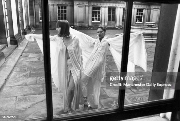 Models Hilka and Hazel wearing dresses by British designer Bill Cross in the courtyard of Chatsworth House, Derbyshire.