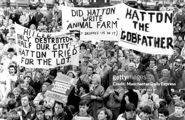 Crowd with banners protesting about Derek Hatton, deputy leader of Liverpool Council. One of the banners reads: �Hitler only destroyed half our city....