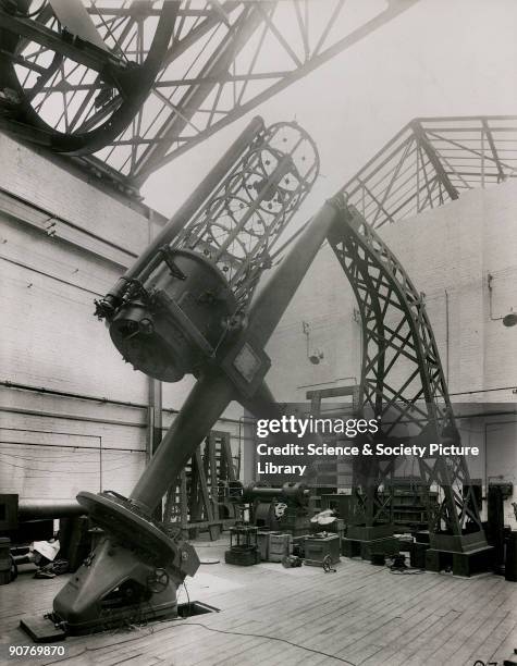 Photograph showing the interior of the optical factory works of the company of Sir Howard Grubb, Parsons and Co in Newcastle-upon-Tyne, England....