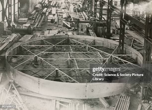 Photograph showing the interior of the works of Sir Howard Grubb, Parsons and Co in Newcastle-upon-Tyne, England. In view is the construction of the...