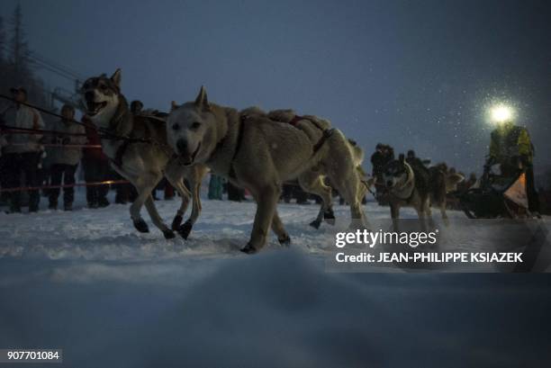 Musher takes the start during the 14th edition of "La Grande Odyssee" sledding race across the Alps on January 20, 2018 in Val Cenis Lanslevillard. /...