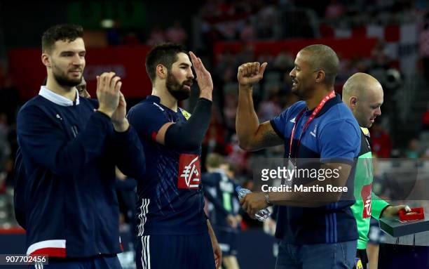Didier Dinart, head coach of France celebrate with team mate Nikola Karabatic the Men's Handball European Championship main round match between...