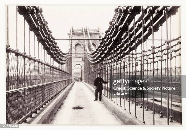 Photographic view across the Menai Suspension Bridge in Bangor, North Wales, published by Francis Bedford & Co. Built by one of England's greatest...