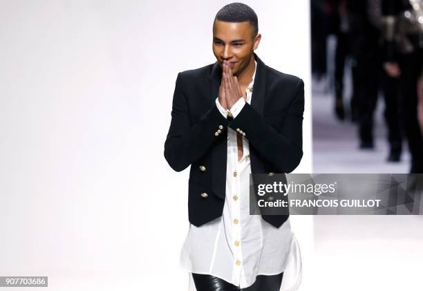 French fashion designer Olivier Rousteing acknowledges the audience at the end of the Balmain fashion show during the Men's Fall/Winter 2018/2019...