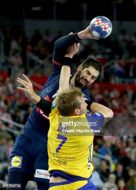 Max Djar of Sweden challenges Nikola Karabatic of France during the Men's Handball European Championship main round match between Sweden and France...