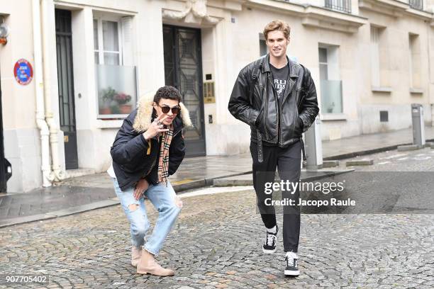 Nick Truelove and model arrive at Balmain Homme Menswear Fall/Winter 2018-2019 show as part of Paris Fashion Week on January 20, 2018 in Paris,...