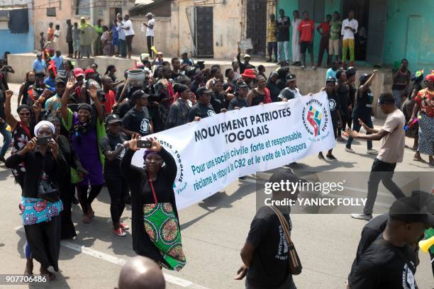 Togolese women dressed in black take to the streets of the capital Lome during a protest rally against Togo's president on January 20, 2018. A...