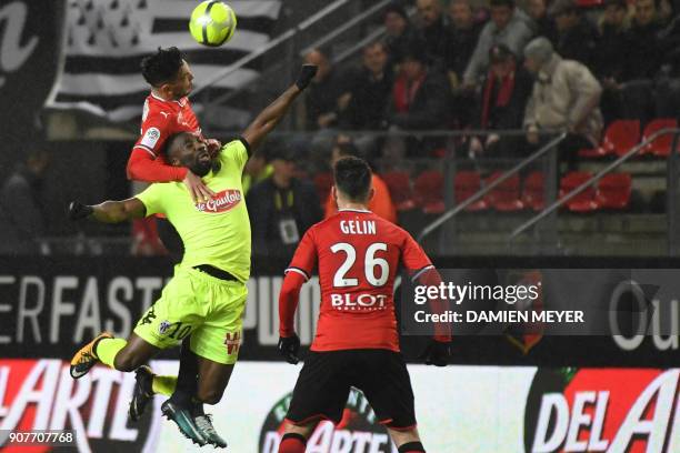 Rennes' Algerian defender Ramy Bensebaini vies with Angers' French forward Gilles Sunu during the French L1 football match between Rennes and Angers...