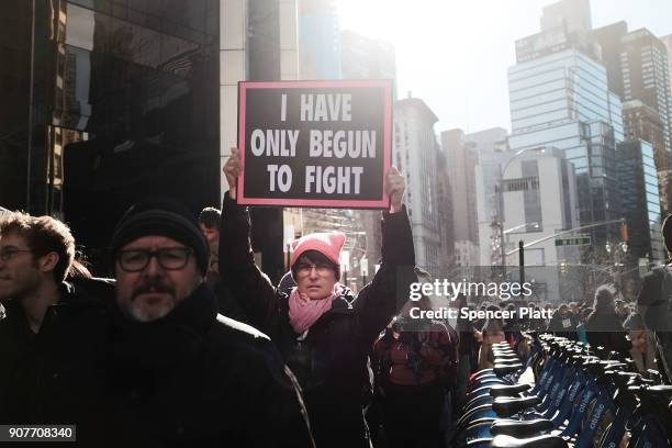 Thousands of men and women hold signs and rally while attending the Women's March on January 20, 2018 in New York, United States. Across the nation...