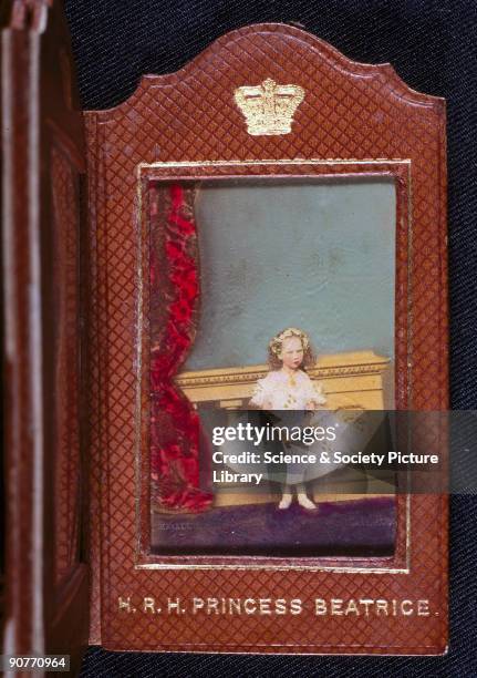 Hand-coloured carte de visite photograph in a folding presentation case, by John Mayall of 224 Regent Street, London, showing Queen Victoria's...