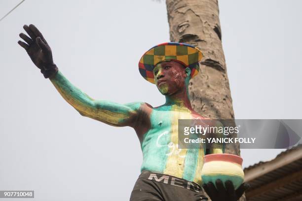 Togolese man with body paint in the colours of the national flag and the letter C92 referring to the return to the 1992 Constitution in Togo and for...