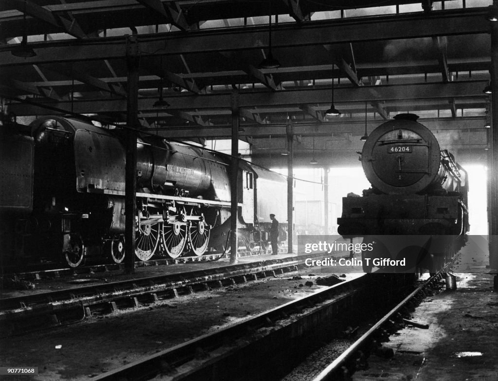 Two Pacific 4-6-2 express locomotives in Polmadie engine shed, 18 July 1961.