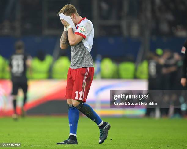 Andre Hahn of Hamburg looks dejected after the second goal during the Bundesliga match between Hamburger SV and 1. FC Koeln at Volksparkstadion on...