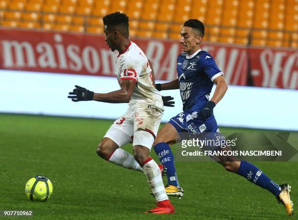 Troyes' Algerian midfielder Saîf-Eddine Khaoui vies with Lille's Brazilian midfielder Thiago Mendes during the French L1 football match between...